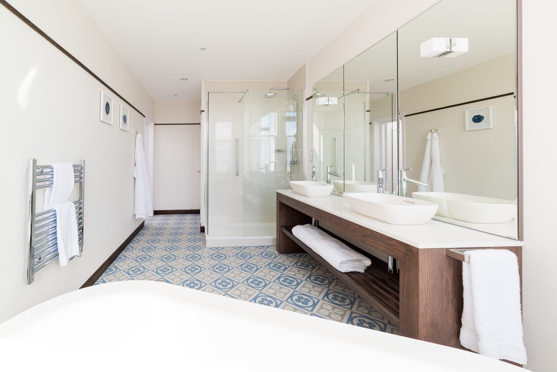 large suite bathroom with roll-top bath
