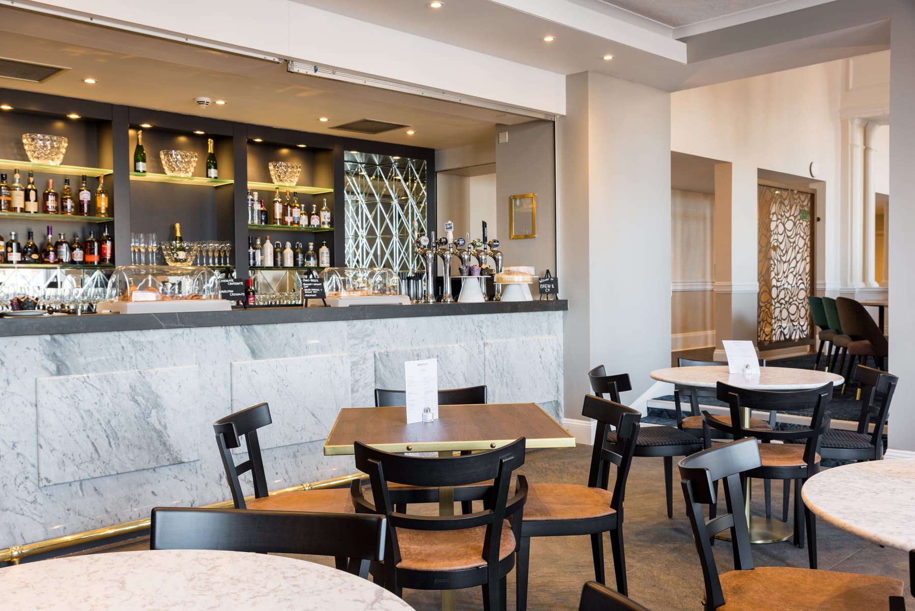 the bar and dining area at the Perle Oban Hotel